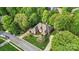 Overhead view of home with mature trees, beautiful landscape, and large driveway at 11424 Stonebriar Dr, Charlotte, NC 28277