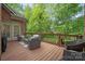 Spacious back deck with outdoor seating and natural surroundings offers a perfect space for relaxation and entertaining at 11424 Stonebriar Dr, Charlotte, NC 28277