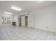 This finished basement has tile floors, recessed lighting, and a window at 11424 Stonebriar Dr, Charlotte, NC 28277
