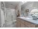 This updated bathroom features a large sink, vanity, and walk-in shower at 11424 Stonebriar Dr, Charlotte, NC 28277