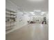 Spacious garage with pegboard walls, shelving and storage options for organization at 11424 Stonebriar Dr, Charlotte, NC 28277