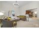 Bright living room with an open layout, high ceilings, access to kitchen and dining room at 11424 Stonebriar Dr, Charlotte, NC 28277