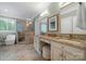 This main bathroom has double sinks and a glass-enclosed shower, creating a luxurious space at 11424 Stonebriar Dr, Charlotte, NC 28277