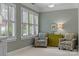 This sitting room has plantation shutters that add architectural interest and character at 11424 Stonebriar Dr, Charlotte, NC 28277