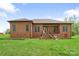 Beautiful brick home with a well-manicured lawn, offering a classic, inviting and serene outdoor space at 121 Capstone Ct, Statesville, NC 28625