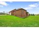 Brick home with a large backyard and attached garage, offering functionality and beauty at 121 Capstone Ct, Statesville, NC 28625