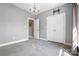 Bedroom featuring gray carpet, chandelier, and closet, perfect for relaxation and storage at 121 Capstone Ct, Statesville, NC 28625