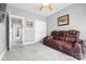 Inviting bedroom featuring a leather couch, and a ceiling fan, designed for comfort and relaxation at 121 Capstone Ct, Statesville, NC 28625
