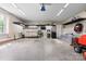 Spacious garage with ample storage shelves, featuring a clean floor, and a organized area for vehicles and projects at 121 Capstone Ct, Statesville, NC 28625