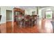 Kitchen with an island and bar-stool seating, dark wood cabinets, and hardwood flooring at 121 Capstone Ct, Statesville, NC 28625