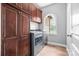 Convenient laundry room with plenty of storage, a large window and new appliances at 121 Capstone Ct, Statesville, NC 28625