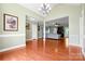 Spacious living room featuring hardwood floors, detailed trim, and access to various living spaces at 121 Capstone Ct, Statesville, NC 28625