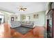 Open-concept living room with hardwood floors, fireplace, and comfortable seating, creating a cozy ambiance at 121 Capstone Ct, Statesville, NC 28625