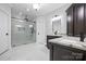 Luxury main bathroom with and sinks and a glass enclosed shower with marble tile at 121 Capstone Ct, Statesville, NC 28625