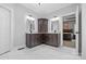 Modern main bathroom with double vanity, granite countertops, and decorative mirrors at 121 Capstone Ct, Statesville, NC 28625