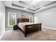 Spacious main bedroom features tray ceilings, neutral carpet, and natural light at 121 Capstone Ct, Statesville, NC 28625