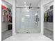 Large shower with frameless glass enclosure, white marble tile, and modern fixtures at 121 Capstone Ct, Statesville, NC 28625