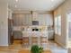 Bright kitchen with stainless steel appliances, island with seating, and modern light fixtures at 1216 Morehead Dr, Salisbury, NC 28144