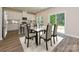 Open concept kitchen featuring a breakfast bar, stainless steel appliances, and wood floors at 1216 Morehead Dr, Salisbury, NC 28144