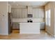 Open kitchen with gray cabinets, white subway tile backsplash, stainless steel appliances, and large island at 1216 Morehead Dr, Salisbury, NC 28144