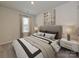Cozy bedroom featuring carpet, a decorative painting, a large window, and soft lighting at 1259 Morehead Dr, Salisbury, NC 28144