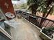 Balcony view includes outdoor furniture, potted plants, and palm trees in the background at 1300 Queens Rd # 210, Charlotte, NC 28207
