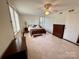 Bright bedroom with light parquet floors, ceiling fan, and plenty of storage at 1300 Queens Rd # 210, Charlotte, NC 28207