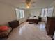 Spacious bedroom with bright windows, ceiling fan, and classic furnishings at 1300 Queens Rd # 210, Charlotte, NC 28207