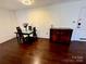 Cozy dining area with a glass-top table set and a buffet to the side at 1300 Queens Rd # 210, Charlotte, NC 28207