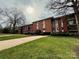 Apartment building with grassy lawn and sidewalks at 1300 Queens Rd # 210, Charlotte, NC 28207