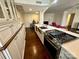 Gourmet kitchen with stainless steel appliances, island, and stylish countertops, open to dining area at 1300 Queens Rd # 210, Charlotte, NC 28207