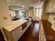 Modern kitchen with stainless steel appliances, bright countertops, and an open view to the living room at 1300 Queens Rd # 210, Charlotte, NC 28207