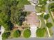 Aerial view of a landscaped house featuring a driveway and well-maintained lawn at 13044 Fen Ct, Huntersville, NC 28078
