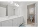 This bathroom has tile floors, a double sink vanity and door leading to a water closet at 13044 Fen Ct, Huntersville, NC 28078