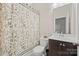 Bathroom featuring a vanity with cabinets, a large mirror and a shower with a pattern shower curtain at 13044 Fen Ct, Huntersville, NC 28078
