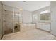 This large bathroom has a separate shower and soaking tub with tile surround and good natural light at 13044 Fen Ct, Huntersville, NC 28078