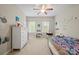This bedroom has good natural light, name graphics and colorful bedding at 13044 Fen Ct, Huntersville, NC 28078