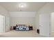 Bright bonus room with vaulted ceiling and neutral carpet, a day bed and natural light at 13044 Fen Ct, Huntersville, NC 28078