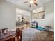 Open bonus area leads to the dining and kitchen, offering a spacious environment for a multitude of activities at 13044 Fen Ct, Huntersville, NC 28078