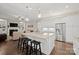 Well-equipped kitchen features a central island and connects to the living room at 13044 Fen Ct, Huntersville, NC 28078