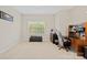 This room is staged as an office with a desk, chair and good natural light at 13044 Fen Ct, Huntersville, NC 28078