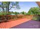 Outdoor wooden back deck overlooking the backyard, perfect for entertaining and relaxation at 1337 Eastside Ave, Albemarle, NC 28001
