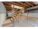 Unfinished basement offers exposed beams and duct work with lots of room for storage and personalization at 1337 Eastside Ave, Albemarle, NC 28001