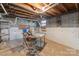 Basement workshop area with worktable, concrete floor, and block wall construction at 1337 Eastside Ave, Albemarle, NC 28001