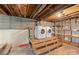 Basement laundry area with raised platform, offering practicality and convenience at 1337 Eastside Ave, Albemarle, NC 28001
