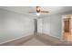 Bright bedroom with carpet, neutral walls, closet, and access to an attached bathroom at 1337 Eastside Ave, Albemarle, NC 28001