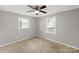 Bright bedroom features neutral walls, carpet flooring, two windows allowing ample natural light at 1337 Eastside Ave, Albemarle, NC 28001