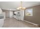 Eat-in kitchen featuring ample cabinets and natural light at 1337 Eastside Ave, Albemarle, NC 28001