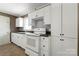 Well-lit kitchen offering lots of storage with white cabinets at 1337 Eastside Ave, Albemarle, NC 28001