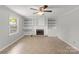 Bright living space with built-in shelves and a cozy fireplace at 1337 Eastside Ave, Albemarle, NC 28001